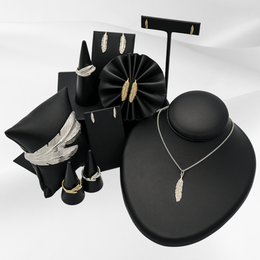 Soar with Joy™ collection of ladies jewelry including earrings, rings, necklace, and cuff bracelet in sterling silver and 14k yellow gold.